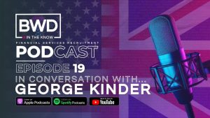 Title of the podcast in white, over a purple hue of the British flag, next to a recording microphone.